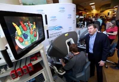 Jeff Studebaker, clinical sales manager for Intuitive Surgical, demonstrates the da Vinci Surgical System, during a Test Drive the Robot event at St. Mark’s Hospital in Millcreek on Wednesday, March 20, 2019.