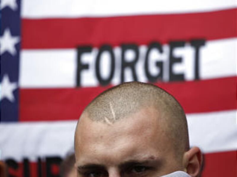A member of the English Defense league, a far-right group that campaigns against Islamic extremism, stands outside the American embassy, in this Saturday, Sept. 11, 2010 in London, England.