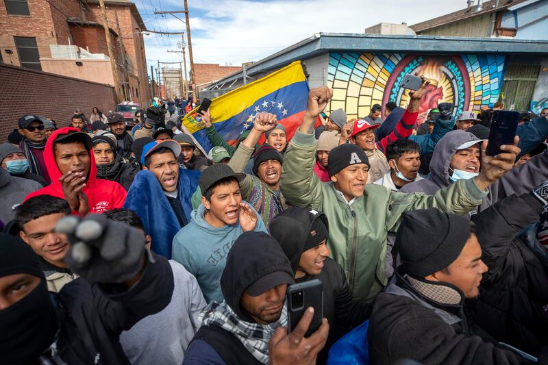 Migrants, mostly from Venezuela, chant slogans as an activists’ march in their support arrives to downtown El Paso, Texas.