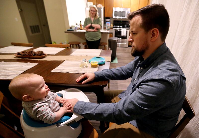 River Hixson-Gray makes a raspberry at her father Jacob Gray as her mother Kelsey Hixson-Bowles watches at home in Sandy on Friday, Jan. 19, 2018.