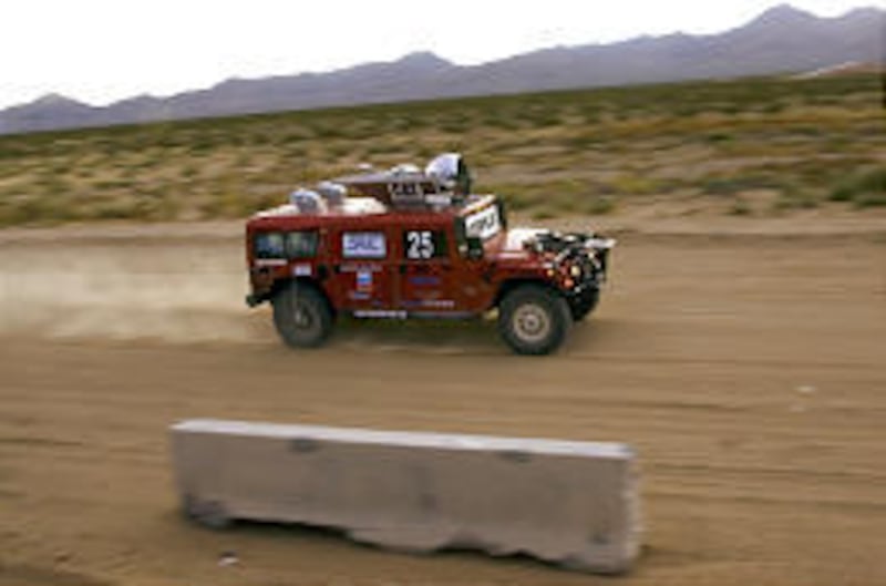 Carnegie Mellon University's unmanned H1ghlander races along the course en route to finishing Saturday's Pentagon-sponored Mojave Desert challenge.