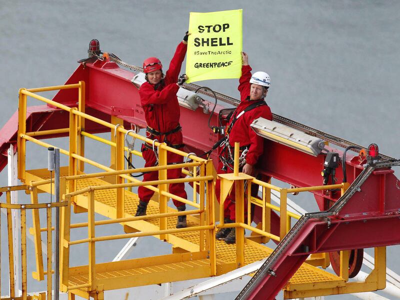 In this photo provided by Greenpeace, actress Lucy Lawless, left, joins activists in stopping a Shell-contracted drillship from departing the port of Taranaki, New Zealand, Friday, Feb. 24, 2012. Lawless, a native New Zealander, best known for her title r