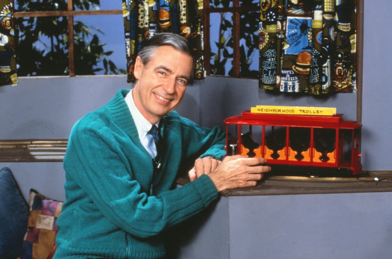 Fred Rogers poses with the Neighborhood Trolley on his show, "Mister Rogers' Neighborhood."