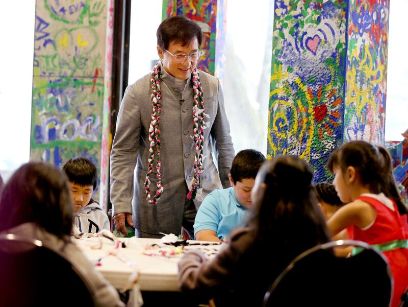 Jackie Chan observes Mountain View Elementary school students as they make crafts using recyclable products at The Leonardo in Salt Lake City on Thursday, Jan. 24, 2019.