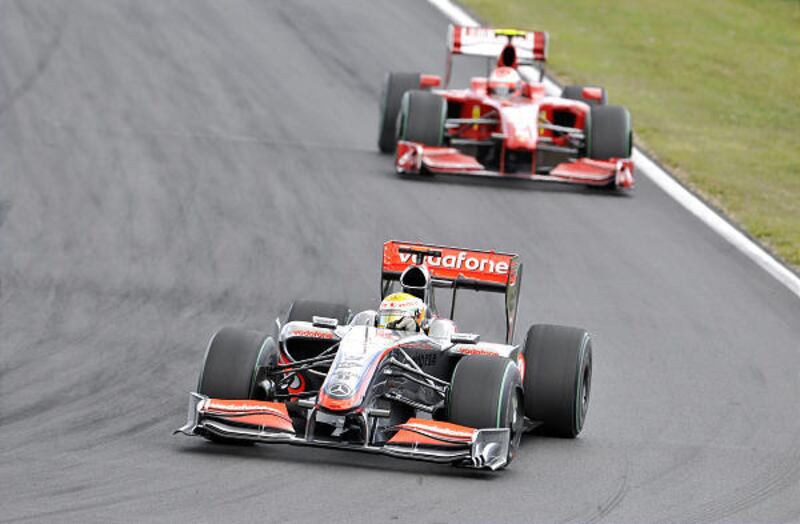McLaren Mercedes driver Lewis Hamilton of Britain steers his car ahead of Ferrari Formula One driver Kimi Raikkonen of Finland during the Hungarian Formula One Grand Prix at the Hungaroring circuit near Budapest, Hungary, Sunday.
