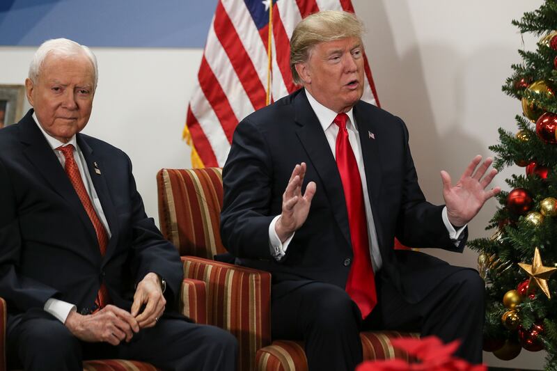 Sen. Orrin Hatch, R-Utah, and President Donald Trump visit with LDS Church leaders at the church's Welfare Square in Salt Lake City on Monday, Dec. 4, 2017.