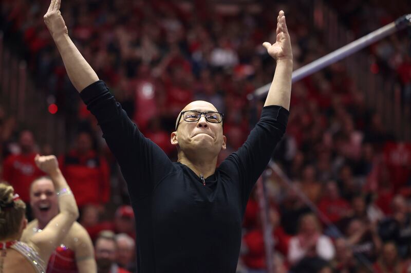 Utah’s gymnastics coach Tom Farden gets the crowd excited before a meet at the Jon M. Huntsman Center.