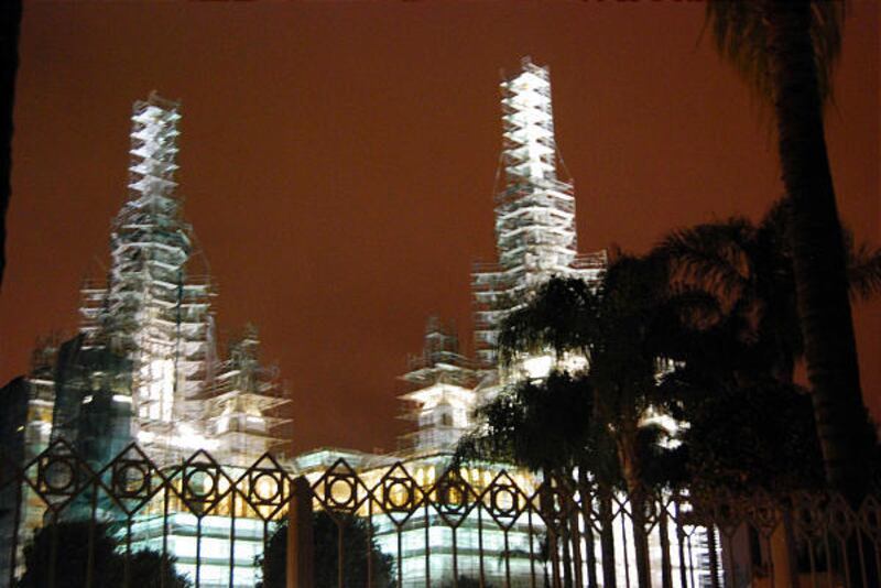 The exterior of the San Diego California Temple is covered in scaffolding in this night view taken earlier this month. Crews have been using nearly two dozen levels of scaffolding while cleaning the white stucco on the four-story edifice, as well as makin