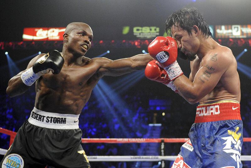 Timothy Bradley, from Palm Springs, Calif., left, lands a punch against Manny Pacquiao, from the Philippines, in their WBO world welterweight title fight Saturday, June 9, 2012, in Las Vegas. Bradley won the fight by split decision.