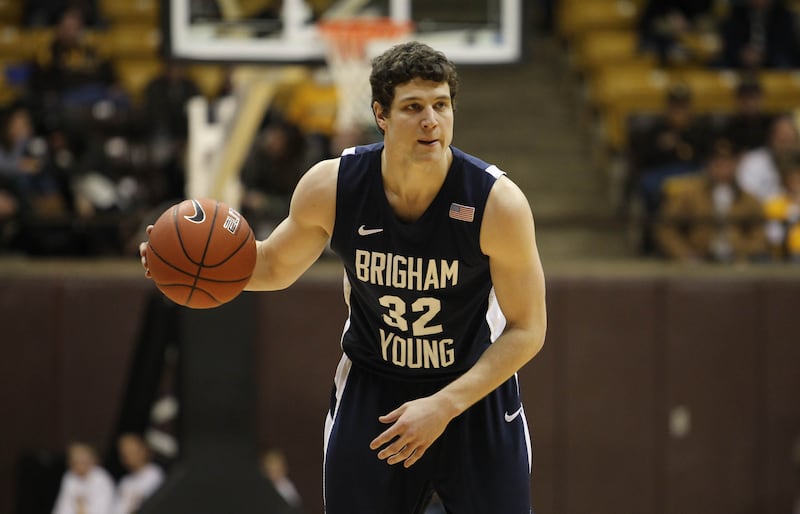BYU guard Jimmer Fredette dribbles upcourt against Wyoming during an NCAA college basketball game in 2011.