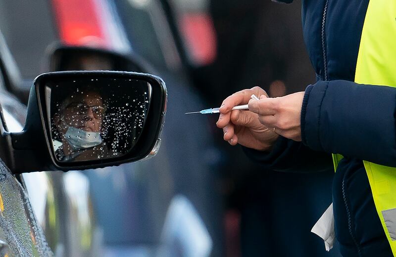 A member of staff prepares to administer the Pfizer-BioNtech COVID-19 vaccine to a member of the public at Hyde Leisure Centre near Manchester, England, Friday Jan. 8, 2021.