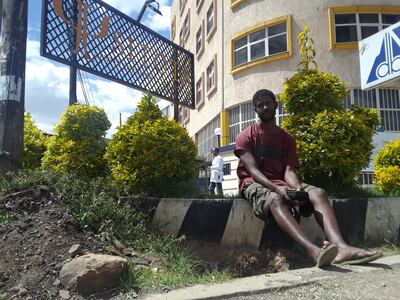 Wubeshet Abebaw sits outside the Sitota Center for Mental Health Care in Addis Ababa, Ethiopia. Abebaw has received in-patient treatment at the center twice.