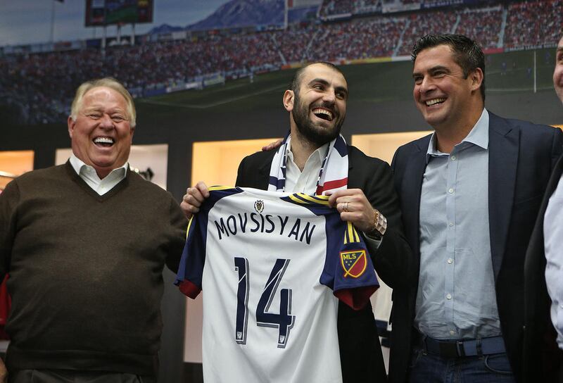 Real Salt Lake owner Dell Loy Hansen, newly signed player Yura Movsisyan and coach Jeff Cassar, left to right, at a Real Salt Lake press conference  Tuesday, Jan. 19, 2016, in Salt Lake City.