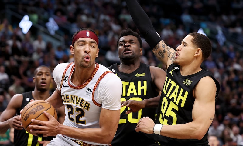 Denver Nuggets forward Zeke Nnaji (22) battles Utah Jazz center Udoka Azubuike (20) and Utah Jazz forward Juan Toscano-Anderson (95) as he goes for a shot as Utah and Denver play at Vivint Arena in Salt Lake City on Saturday, April 8, 2023. Jazz won 108-104.