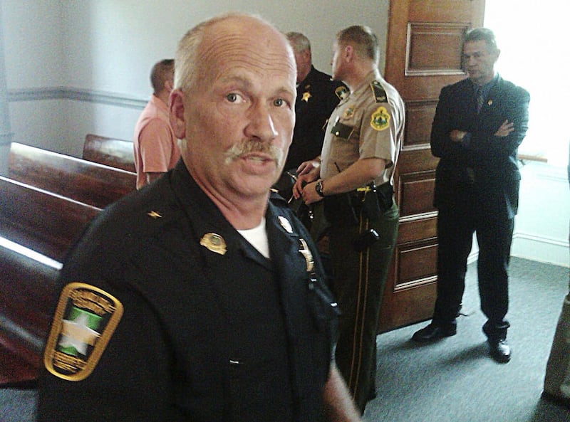 Grand Isle County Sheriff Ray Allen pauses between hugs and well-wishes following the ceremony where he was sworn in Wednesday, Aug. 10, 2011 in North Hero, Vt. For Allen, it was a bittersweet day: he succeeds his wife Sheriff Connie Allen, who committe