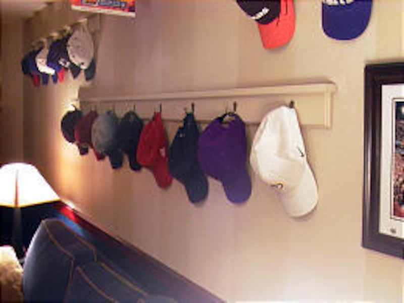 Boards and hooks provide a way to display your collected sports hats for years to come.