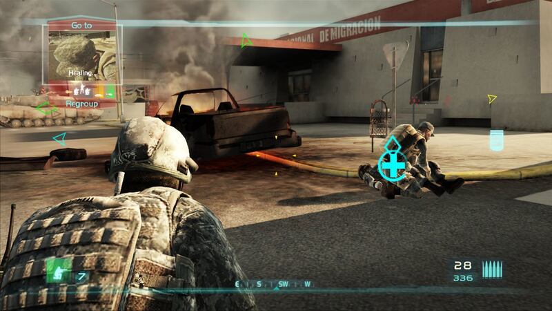 A Special Forces soldier stands watch as a teammate revives an ally in "Tom Clancy's Ghost Recon: Advanced Warfighter 2."