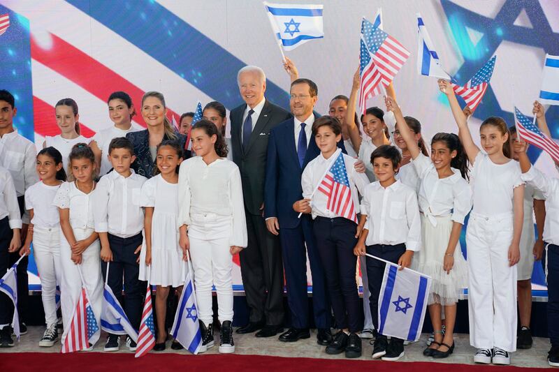 President Joe Biden stands with Israeli President Isaac Herzog on Thursday, July 14, 2022, in Jerusalem.
