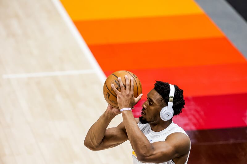 Utah Jazz guard Donovan Mitchell, who will not play in Game 1 of the NBA playoffs against the Memphis Grizzlies, warms up at Vivint Smart Home Arena in Salt Lake City.