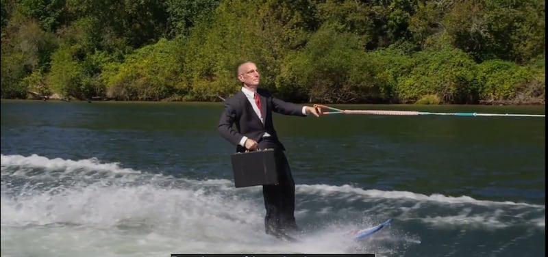 An image from an obviously fake video of former BYU-Idaho President Henry J. Eyring waterskiing in a river is shown.
