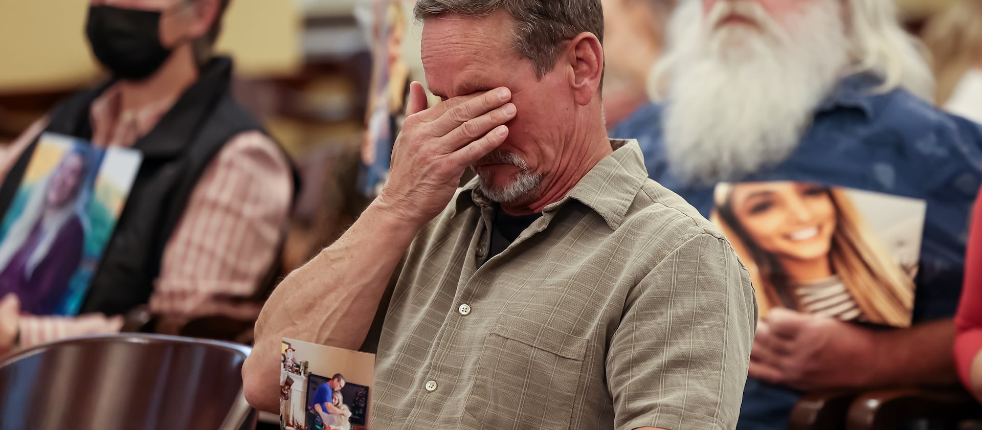 Gerry Allred listens as his wife, Tammy Allred, talks about the death of their daughter, Kylie Kaplanis.