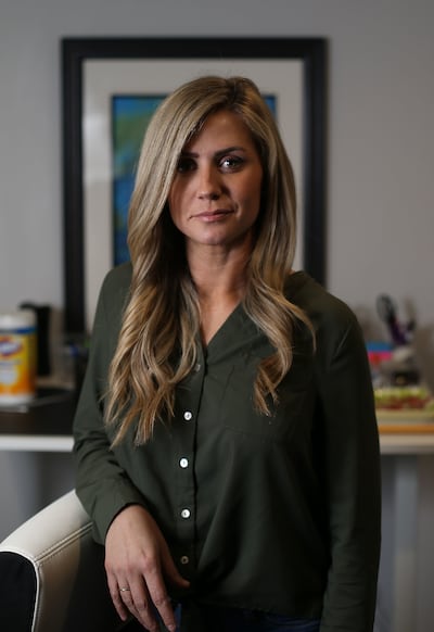 Catie Cartisano is photographed at her office in Murray on Thursday, Feb. 28, 2019. Cartisano, who is 10 years sober, had her criminal record expunged.
