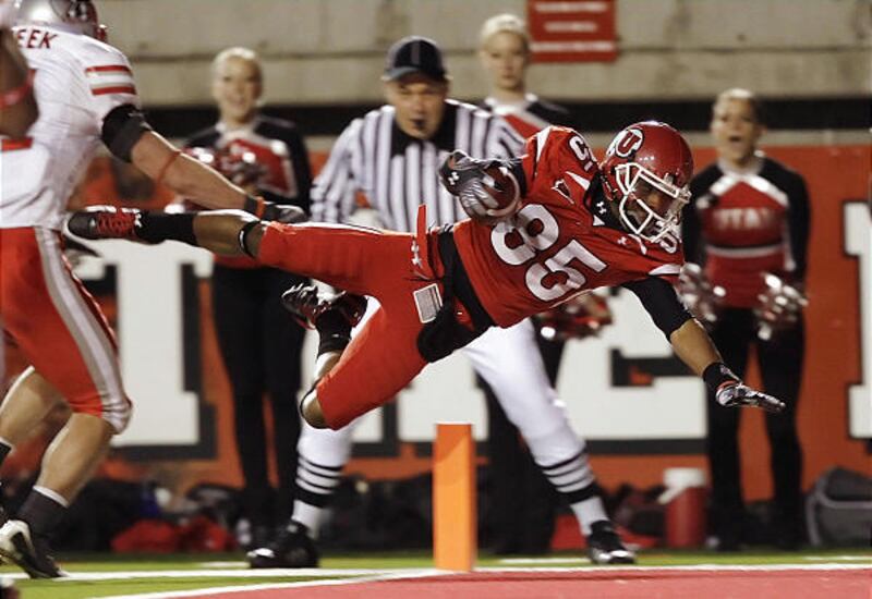 Utah wide receiver Jereme Brooks dives into the end zone for a touchdown against New Mexico, one of two TDs he scored Saturday vs. the Lobos.