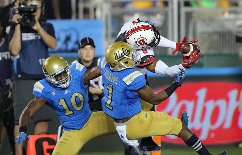 Utah Utes wide receiver Dres Anderson (6) catches a touchdown pass between UCLA's Ishmael Adams (1) and UCLA Bruins defensive back Fabian Moreau (10) as the University of Utah plays UCLA in the Rose Bowl during NCAA PAC 12 football action Saturday, Oct.