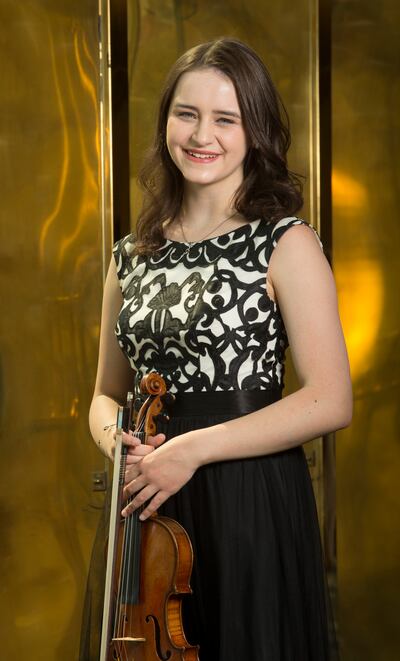 Violinist Natalie Boberg poses for a photo at Abravanel Hall in Salt Lake City on Monday, Aug. 6, 2018. For the 59th annual Salute to Youth concert, Boberg, 18, performed Mark O’Connor’s Double Violin Concerto with violinist Adrian Wu, 18.
