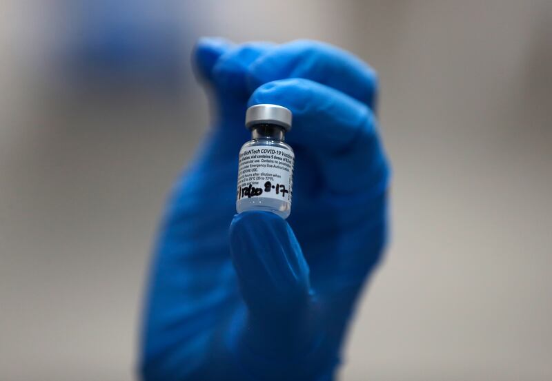 A nurse holds a phial of the Pfizer-BioNTech COVID-19 vaccine at Guy’s Hospital in London, Tuesday, Dec. 8, 2020.