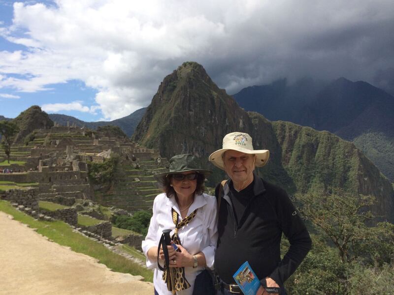 President Russell M. Nelson and Sister Wendy Nelson are show at Machu Picchu in the mountains of Perú.
