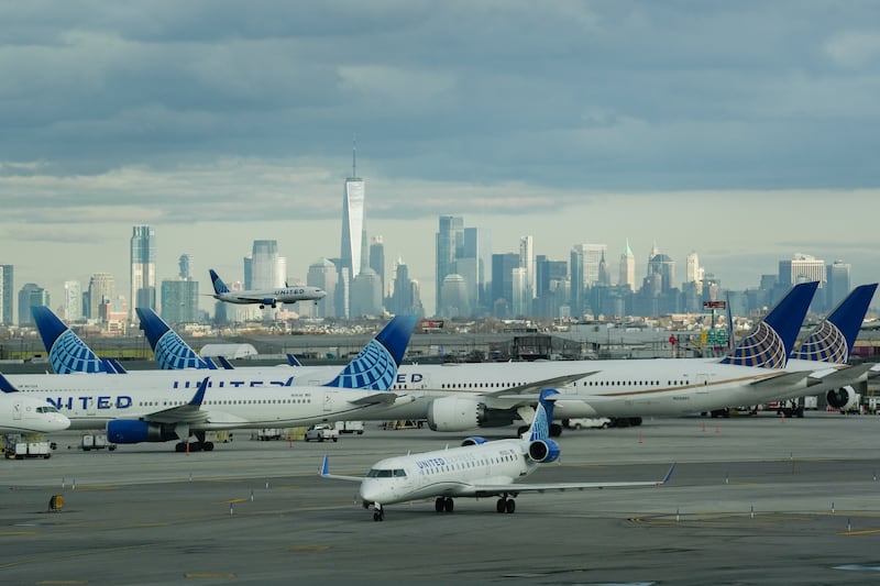 The New York City skyline appears in the background of a picture of Newark Liberty International Airport.