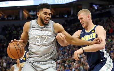 Denver Nuggets player Mason Plumlee, shown here guarding Minnesota Timberwolves center Karl-Anthony Towns during a recent NBA game, visits Salt Lake City restaurant Valter's Osteria when he's in town, Plumlee said during a recent episode of the "Road Trip