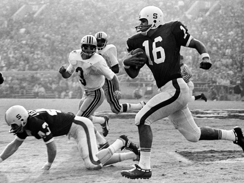 Jim Plunkett of Stanford, a hero in Friday’s Rose Bowl upset victory over Ohio State, sprints through the Buckeye defense for a 22-yard gain to midfield in Pasadena, California on Jan. 2, 1971.