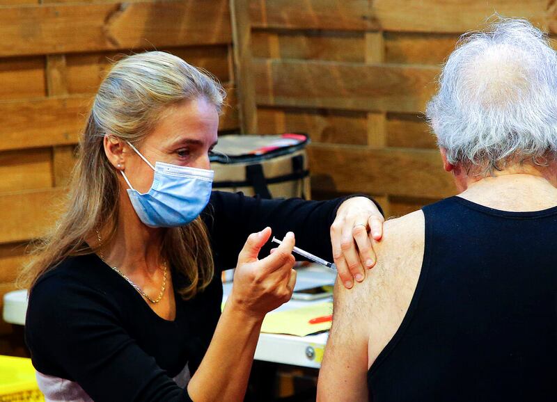 A patient receives a Pfizer COVID-19 vaccine.