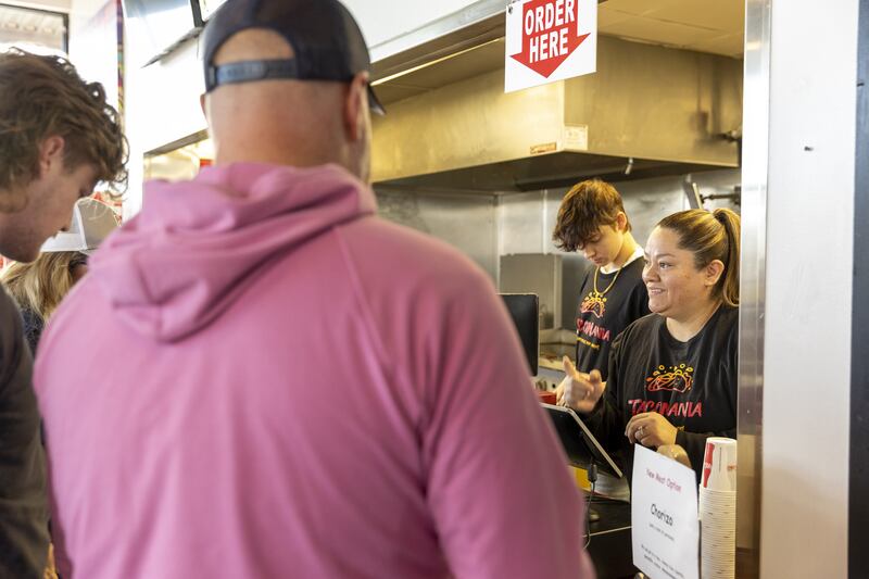 Claudia Martinez waits on customers at TacoMania in Riverton on Saturday.