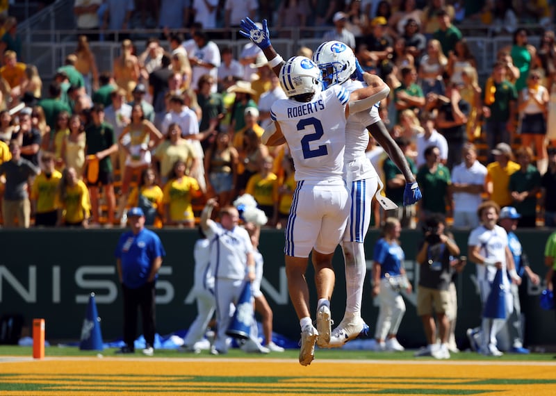 BYU wide receiver Chase Roberts (2) celebrates after a touchdown by wide receiver Darius Lassiter, right, during game against Baylor Saturday, Sept. 28, 2024, in Waco, Texas.