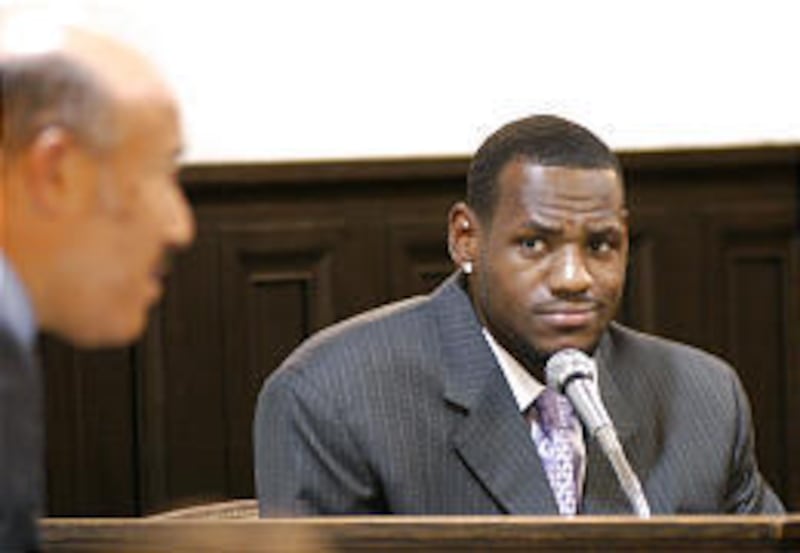 LeBron James waits to testify while his attorney makes an objection.