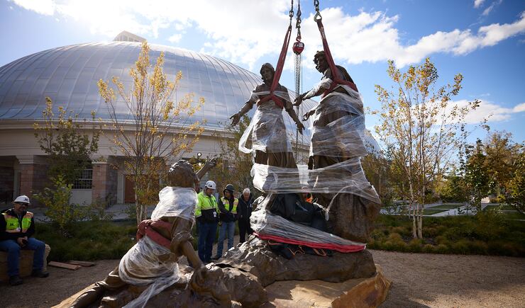 Construction workers place the First Vision statue on Temple Square on Wednesday, Nov. 6, 2024.