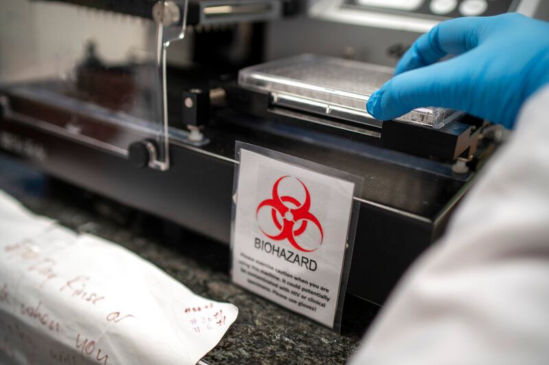 Scientists in Durban, South Africa, work on the omicron variant of the COVID-19 virus.