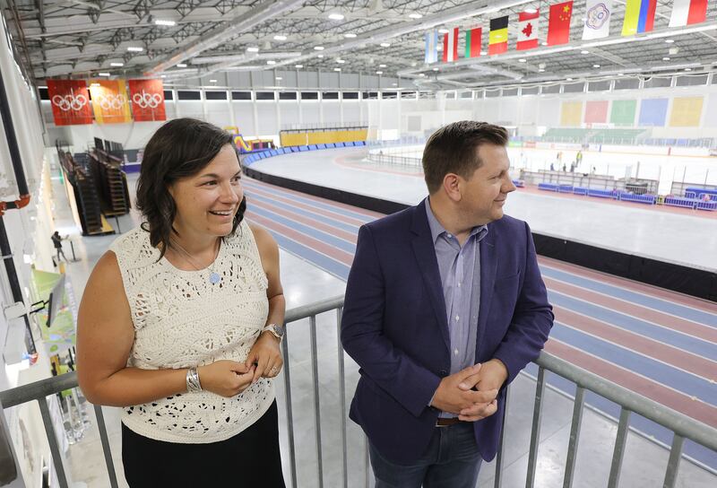 Catherine Raney Norman, chairwoman of the Salt Lake City-Utah Committee of the Games, and Steve Starks, committee vice chairman and Olympic adviser to Gov. Spencer Cox, look over the Utah Olympic Oval in Kearns.