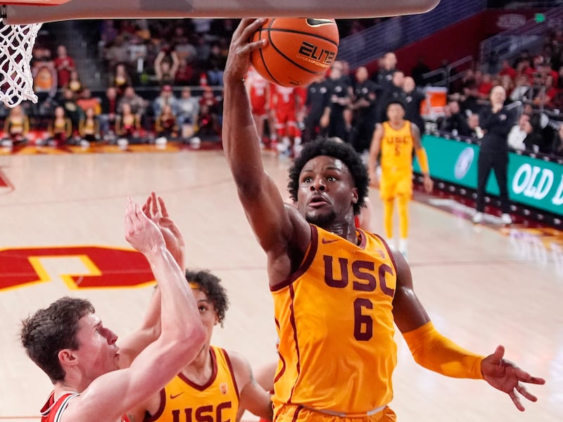 USC guard Bronny James, right, shoots as Utah forward Ben Carlson defends during a game Feb. 15, 2024, in Los Angeles.
