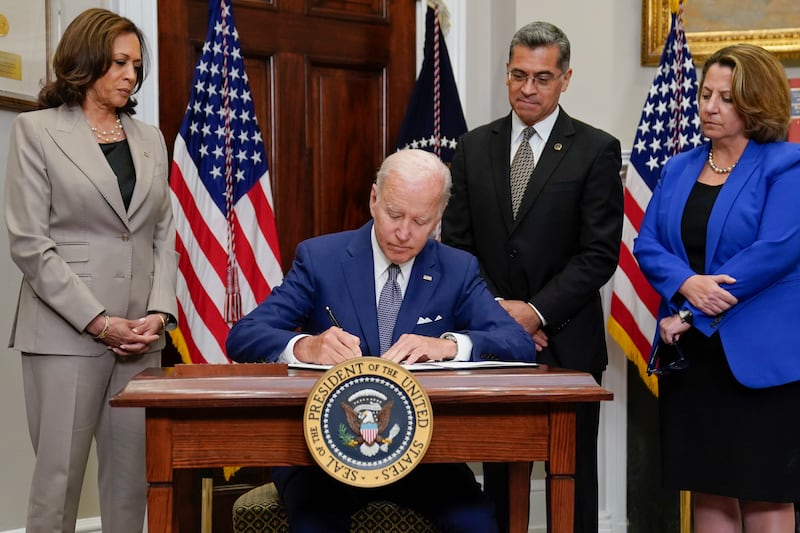President Joe Biden signs an executive order on abortion access during an event in the Roosevelt Room of the White House, Friday, July 8, 2022, in Washington.