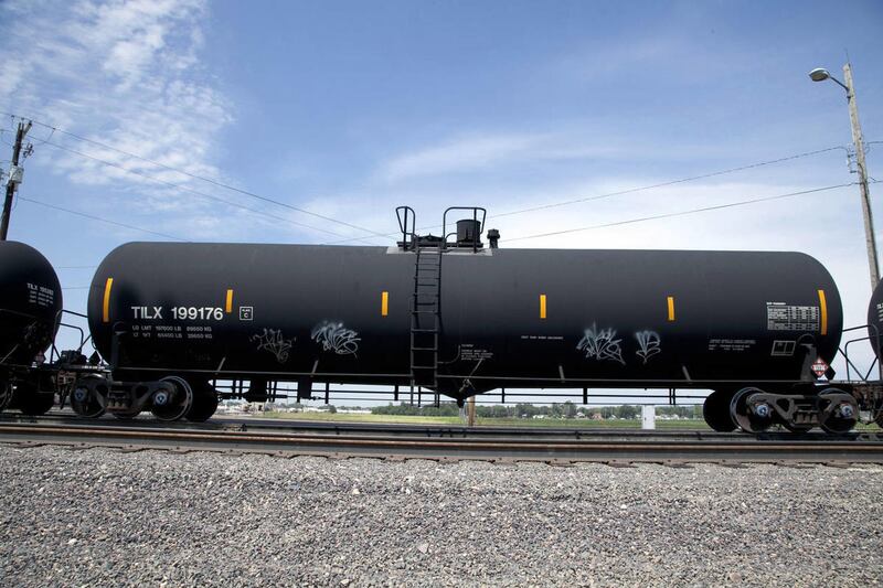 In this Aug. 8, 2012 photo, a DOT-111 rail tanker passes through Council Bluffs, Iowa. DOT-111 rail cars being used to ship crude oil from North Dakota\'s Bakken region.