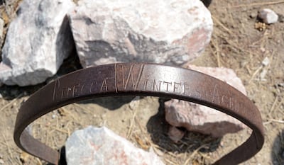 The Rebecca Winters grave, Scottsbluff, Nebraska. Her name is seen inscribed in the wagon wheel.