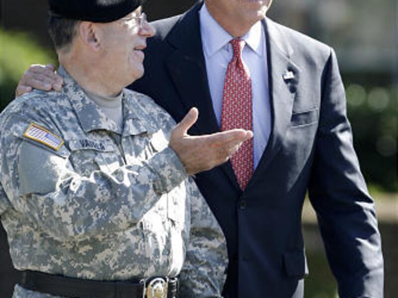 Democratic vice presidential candidate Sen. Joe Biden, D-Del., right, walks with Delaware Adjutant General Maj. Gen. Francis D. Vavala before the start of a deployment ceremony for a unit of the Delaware Army National Guard on Friday.