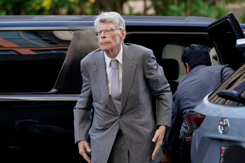 Author Stephen King arrives at federal court before testifying for the Department of Justice as it bids to block the proposed merger of two of the world’s biggest publishers, Penguin Random House and Simon & Schuster, Tuesday, Aug. 2, 2022, in Washington.