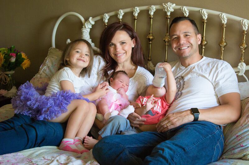 Leah Darrow, author of "The Other Side of Beauty," poses with her family. The Darrows are expecting their fourth child.