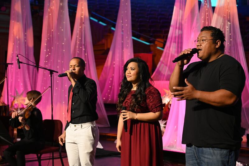 Performers sing at a past Christmas event on Temple Square. There will be limited activities and lights during the Christmas season this year.