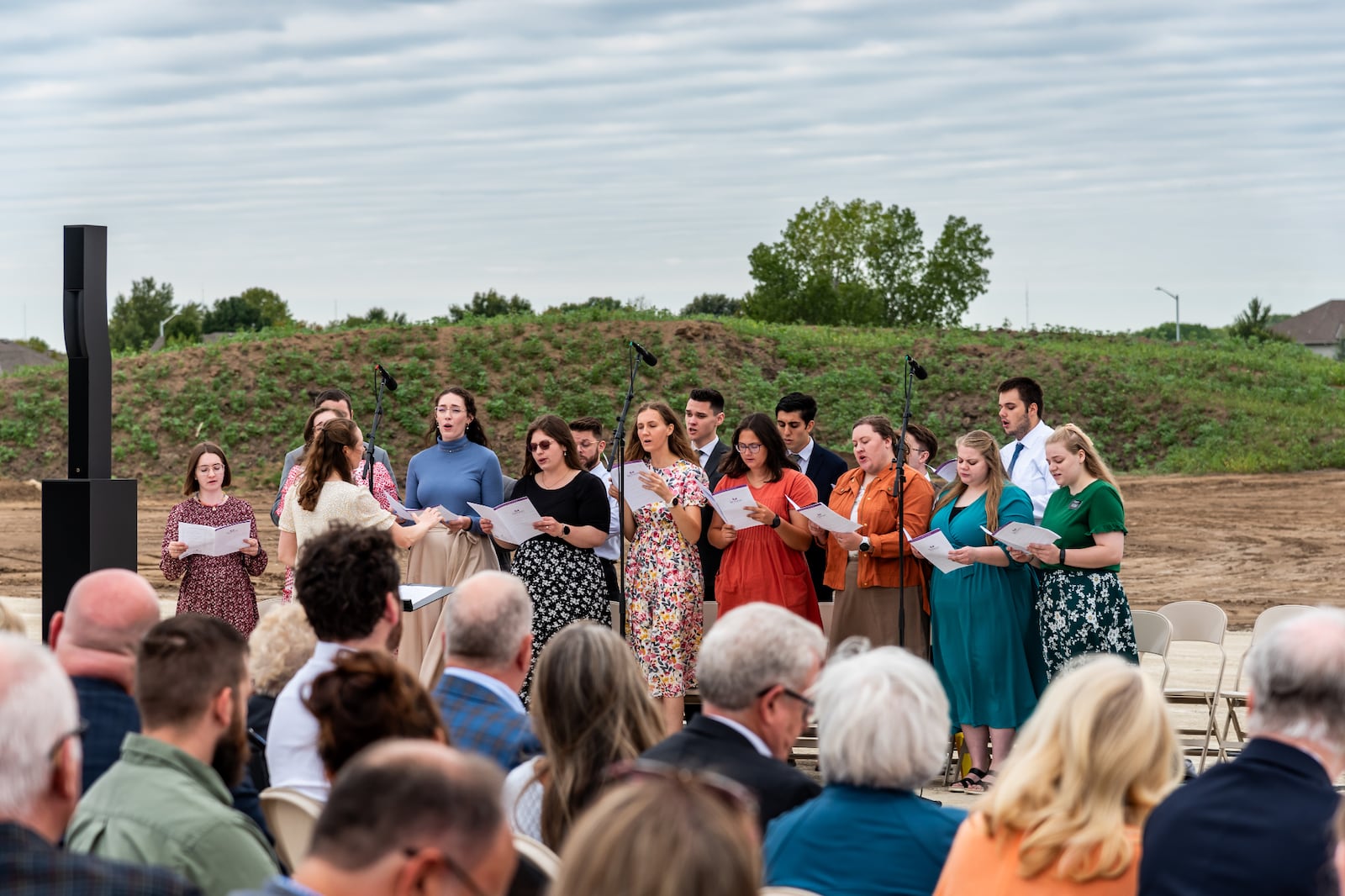 A choir of young single adults sings at the groundbreaking for the Wichita Kansas Temple.